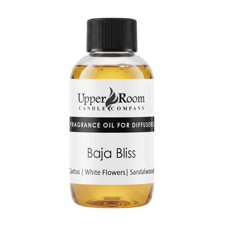 A bottle of Upper Room Candle Company Baja Bliss fragrance oil for diffusers, featuring amber-colored liquid, a white label with black text, and a black ribbed cap, set against a plain white background.
