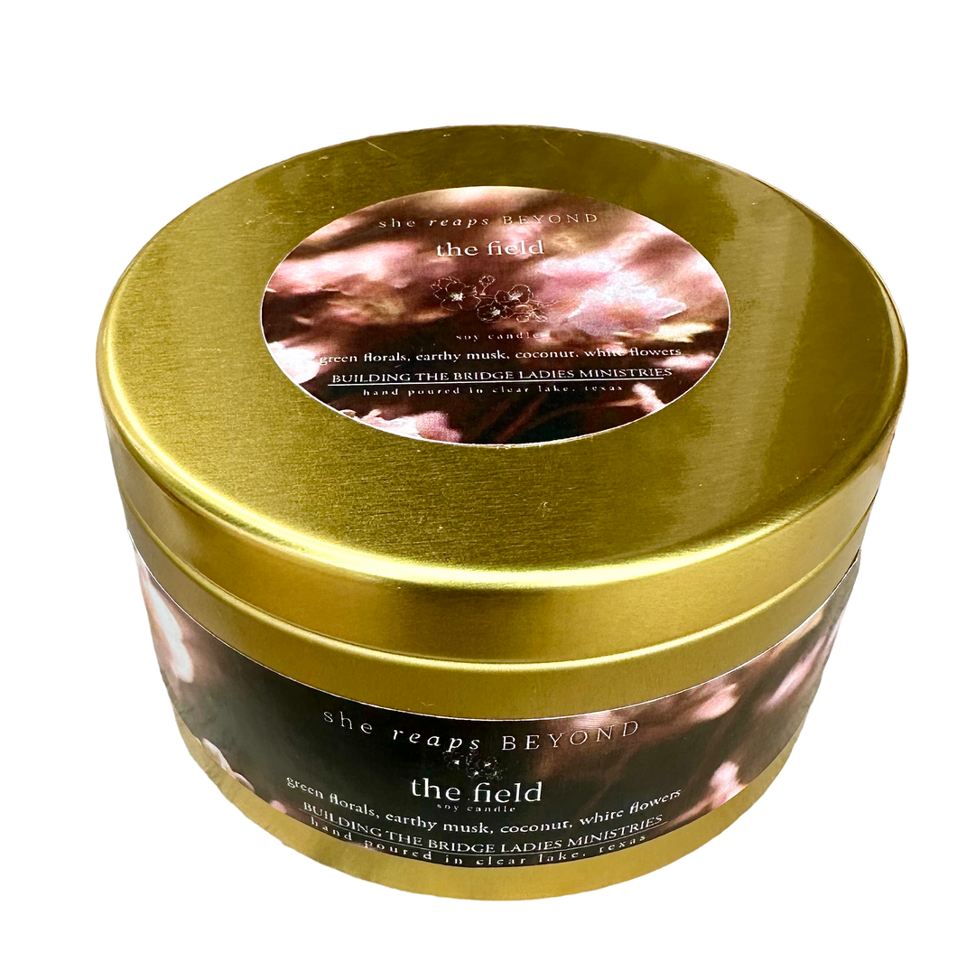 Beyond the Field Candle, Double wick gold tin, building the bridge ladies ministries, upper room candle company top down view