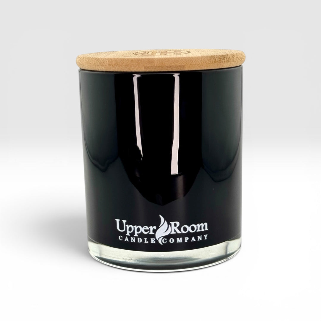 Black candle double wick jar with wooden lid on a white background, featuring 'Upper Room Candle Company' branding.