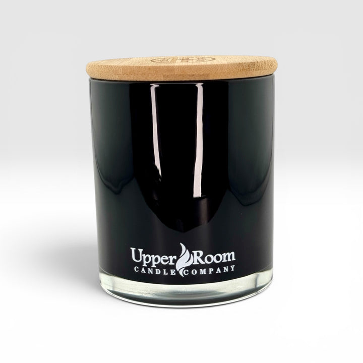 Black candle double wick jar with wooden lid on a white background, featuring 'Upper Room Candle Company' branding.