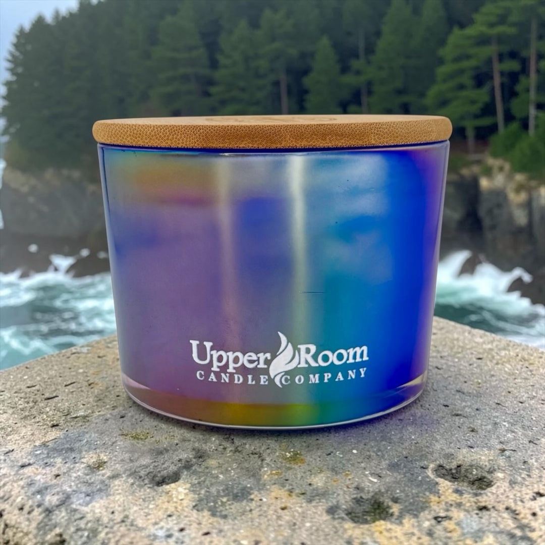 Fierce Forest hand-poured soy wax blend candle by Upper Room Candle Company in an amber jar with black lid, featuring oakmoss, citrus and marine accord for a bold, fresh, masculine scent.
