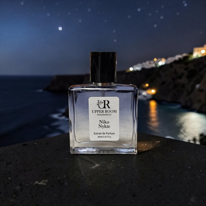 Niko Nykte extrait de parfum by Upper Room Fragrances in a square blue glass bottle with black cap, featuring a fresh masculine scent of mint, green apple, Italian lemon, cedarwood, vetiver and oakmoss.