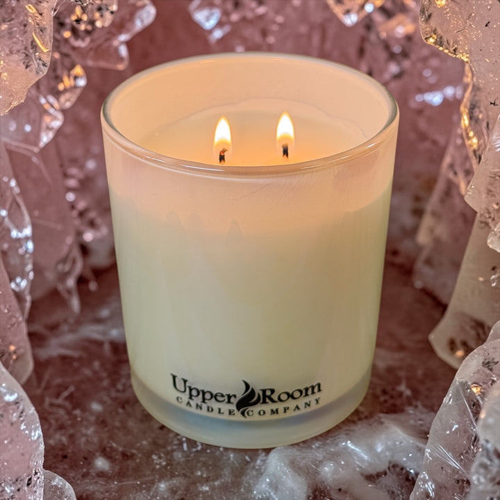 Pink quartz candle in a double wick white jar from upper room candle company