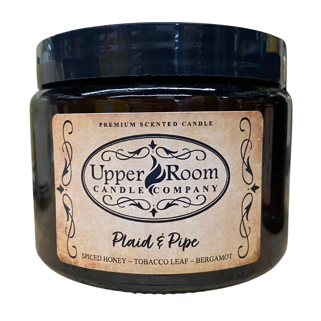Plaid & Pipe candle in a double wick amber jar from upper room candle company