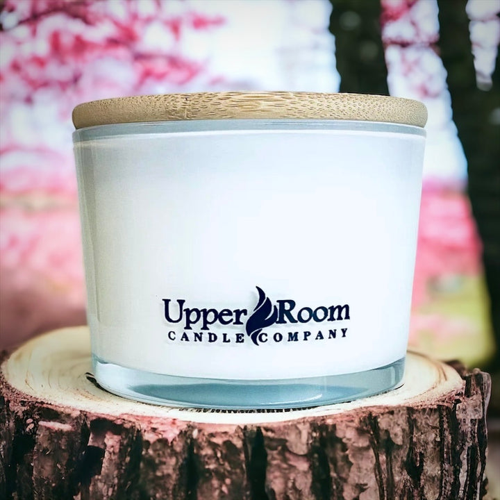 Sweet Cedarwood Candle in a triple wick white jar from upper room candle company