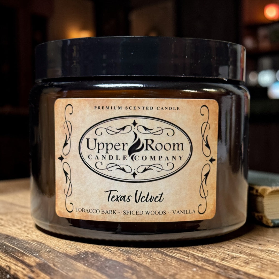 Texas Velvet Candle in a double wick amber jar from upper room candle company