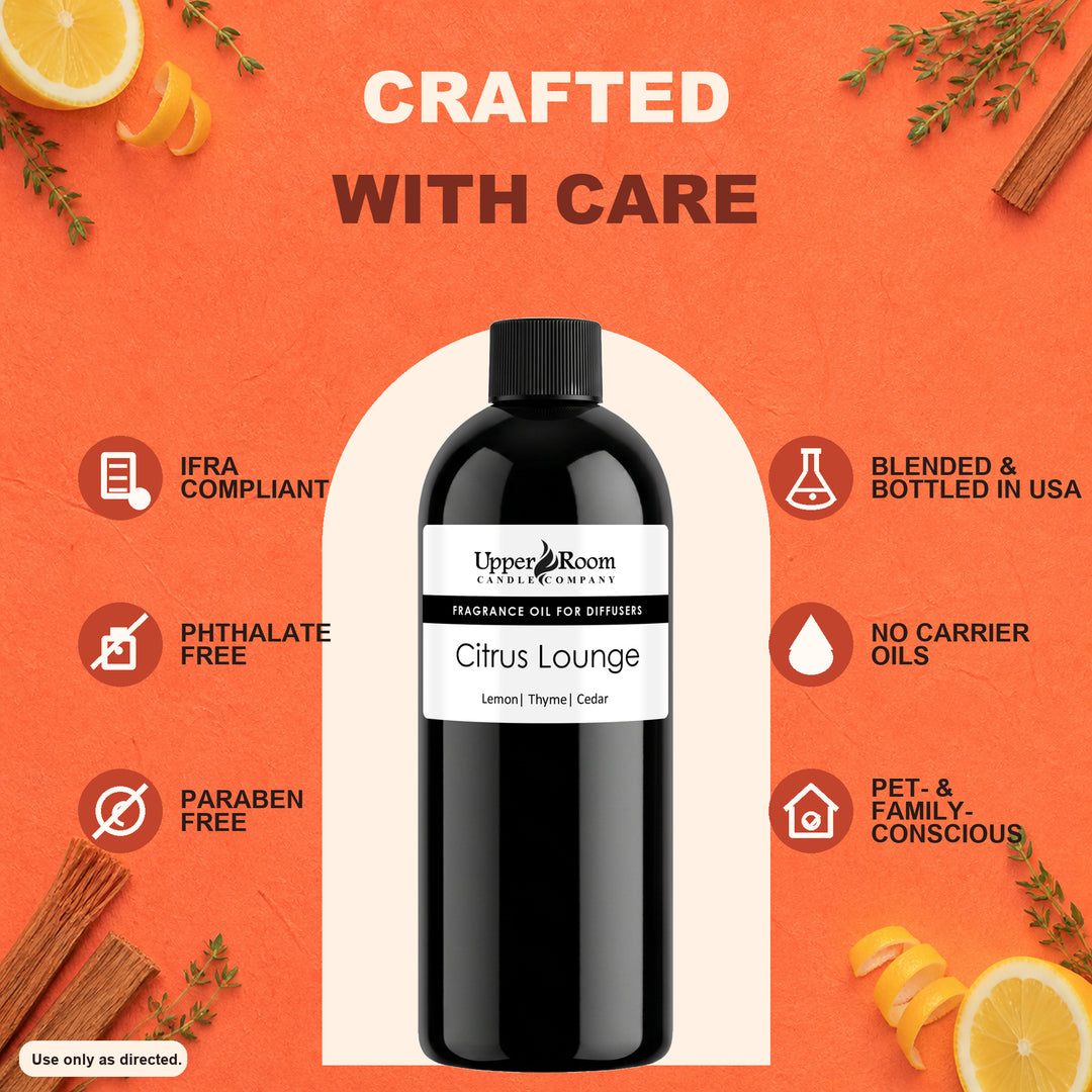 A bottle of Upper Room Scents 'Citrus Lounge' fragrance oil centered on a textured orange background with decorative citrus slices, cinnamon sticks, and herbs. Text around the bottle highlights product features like IFRA compliance, phthalate-free, paraben-free, blended in the USA, no carrier oils, and pet-friendly.