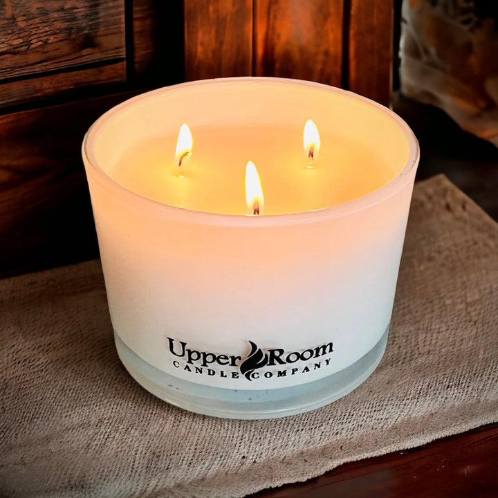 sweet river birch candle in a triple wick white jar from upper room candle company