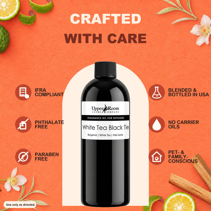 A bottle of Upper Room Apothecary fragrance oil for diffusers, labeled 'White Tea Black Tea,' centered on an orange graphic background with decorative tea leaves, flowers, cinnamon sticks, and icons highlighting product benefits.